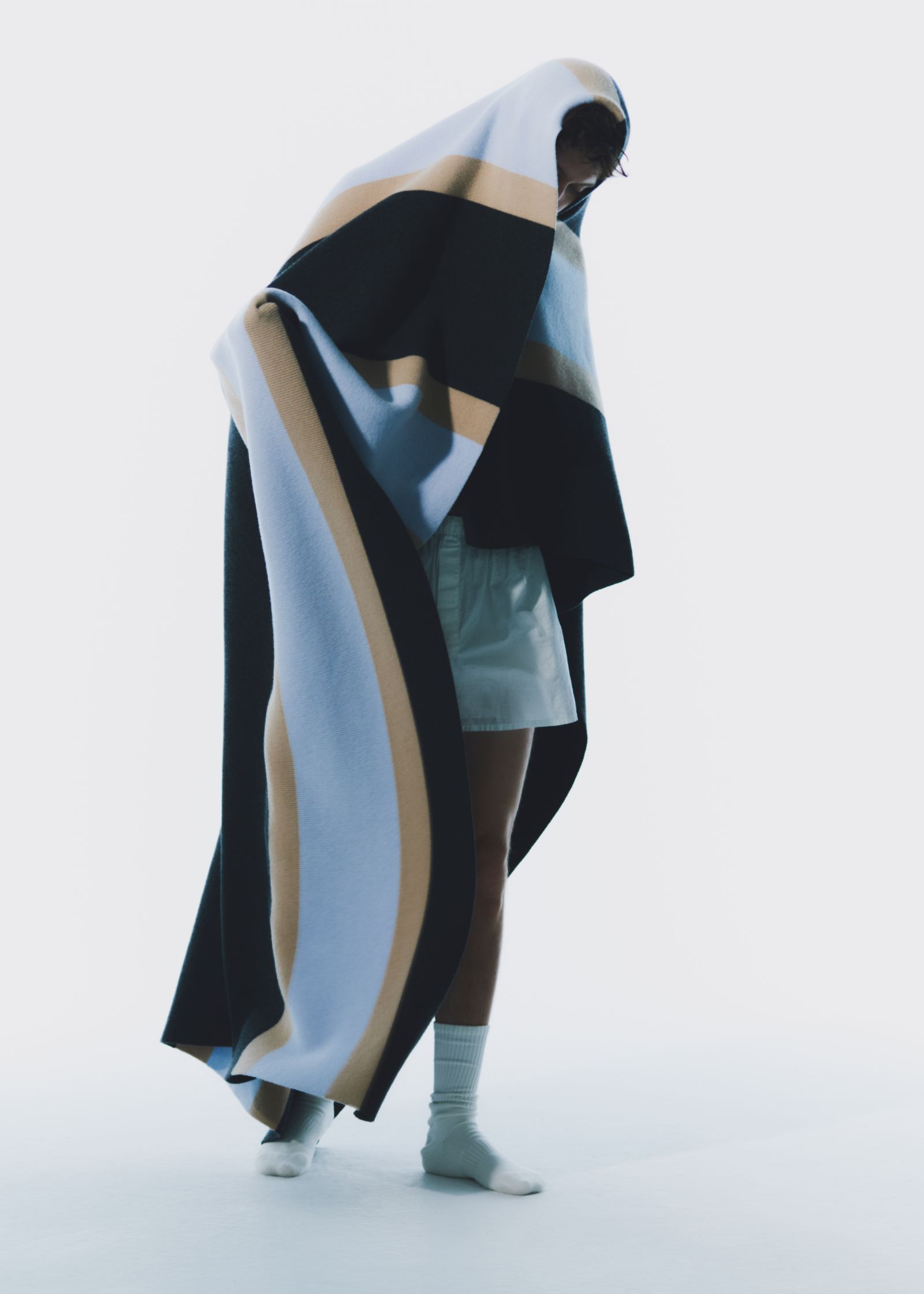Images may contain fashion people cloak clothing socks socks adults and cloaks