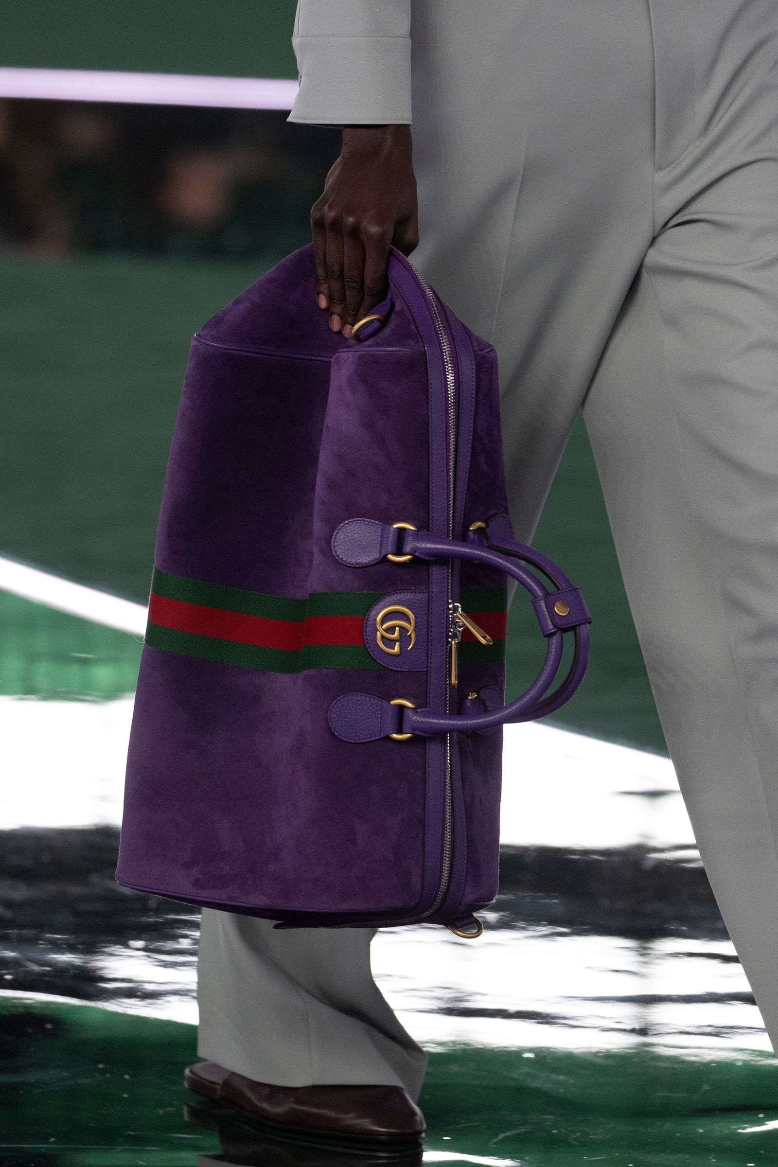 Images may contain accessories bags, handbags, adult wallets, clothes and jackets