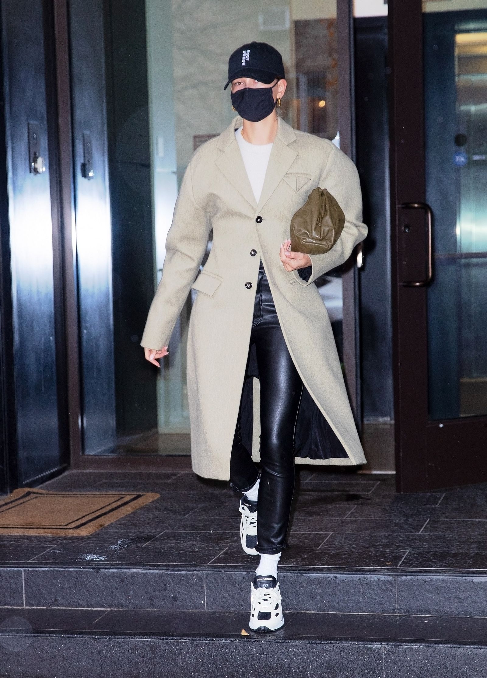 Images may contain clothing, coat, shoes, people and persons
