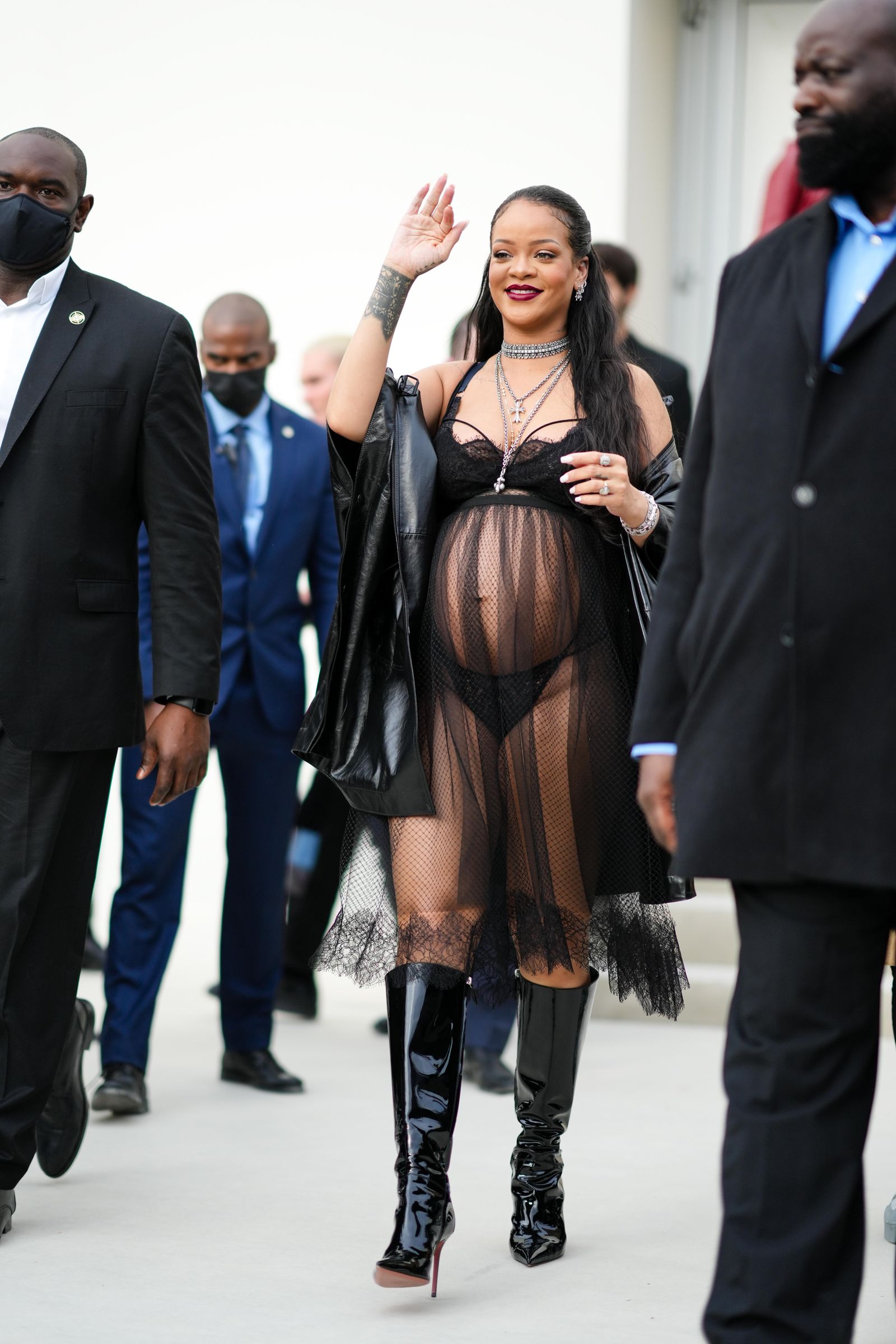 Images may contain Rihanna adult clothing shoes shoes jacket accessories jewelry and necklaces