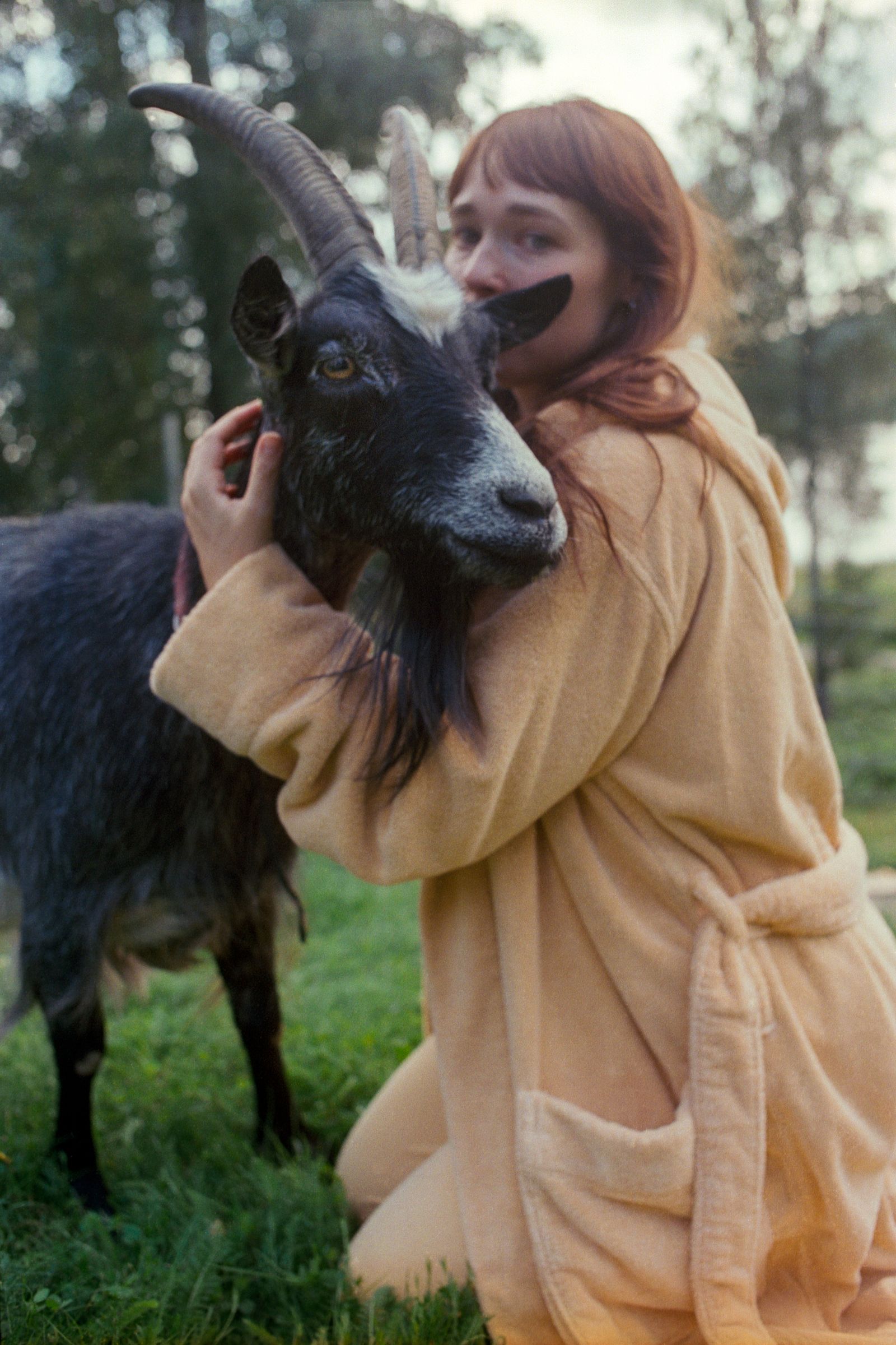 Images may contain facial human photography portrait clothing jacket livestock animal mammal sheep and goat