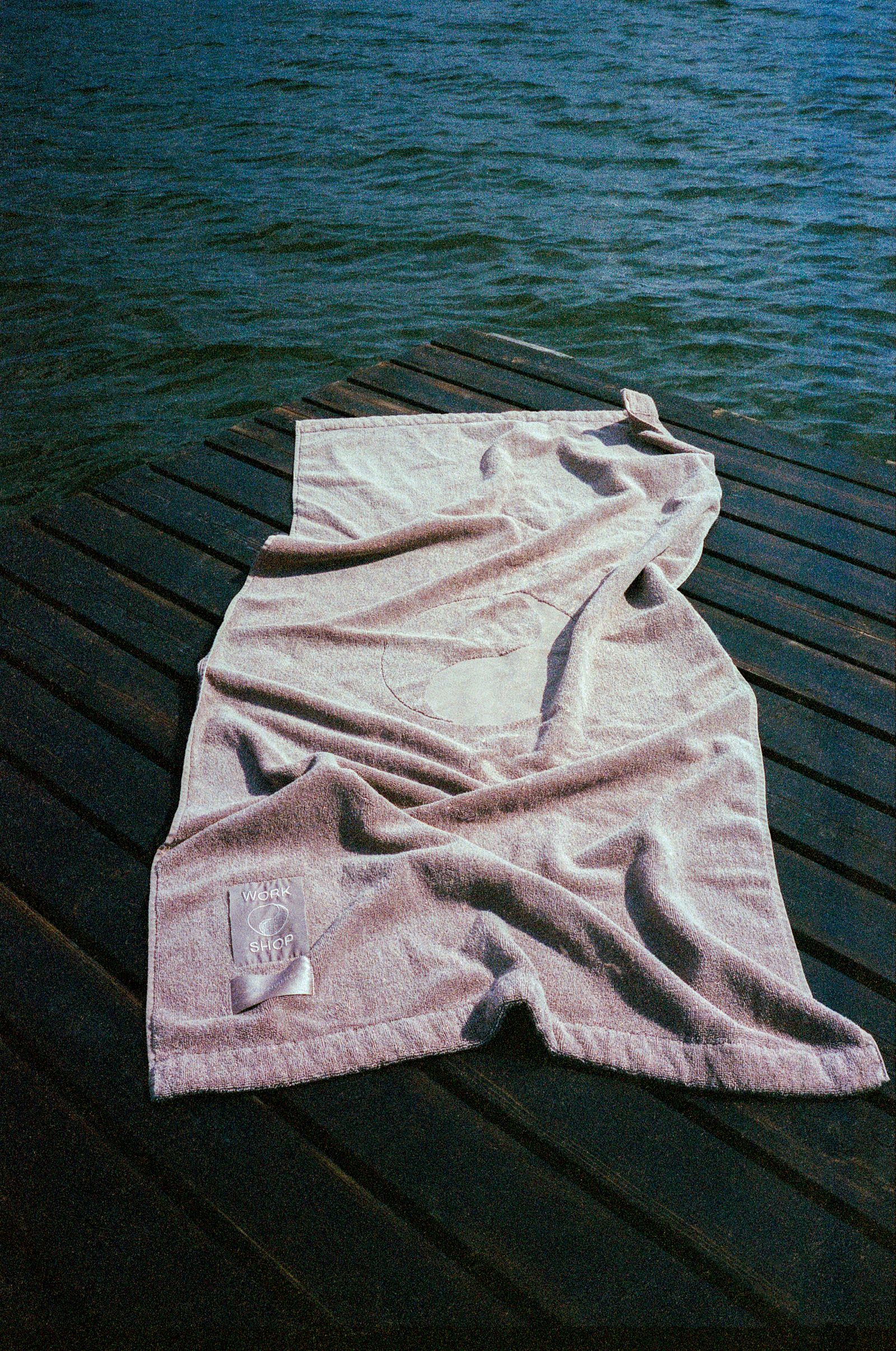 Images may contain beach bench furniture and towels