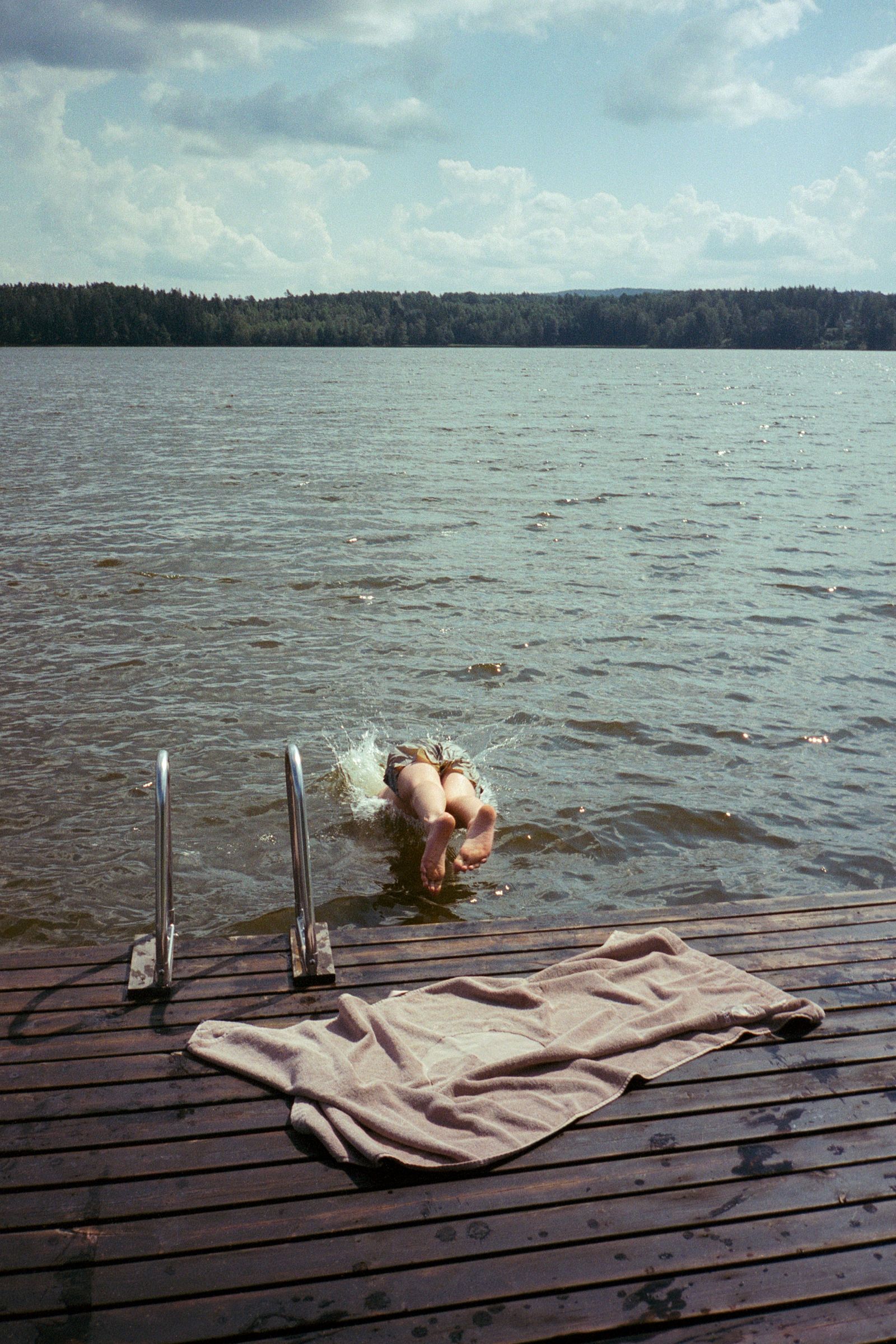 Images may contain beachfront leisure activities sports swimming water sports faces and photography