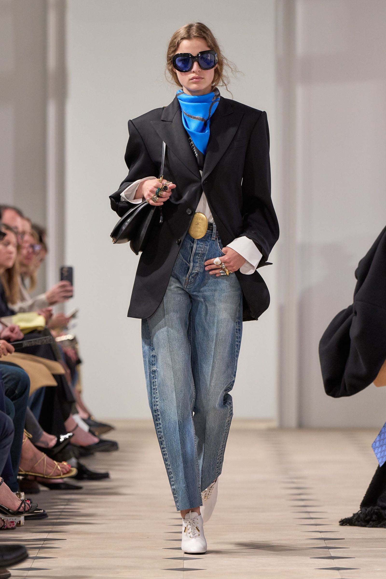 Images may contain clothes, pants, jacket, jacket, jeans, formal wear for suits, adult accessories and glasses