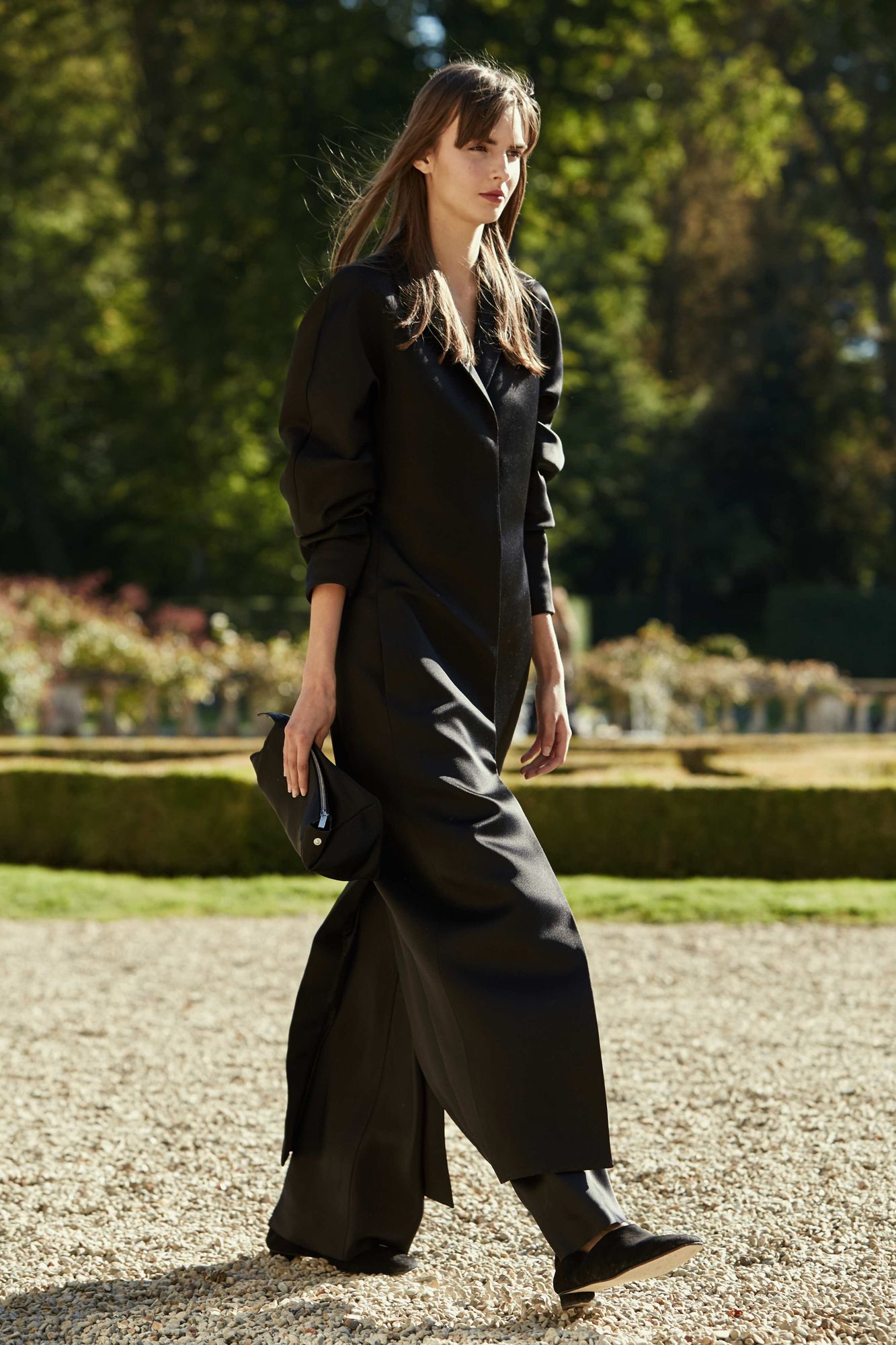 This image may contain clothing clothing evening dress robe fashion dress man sleeves and shoes