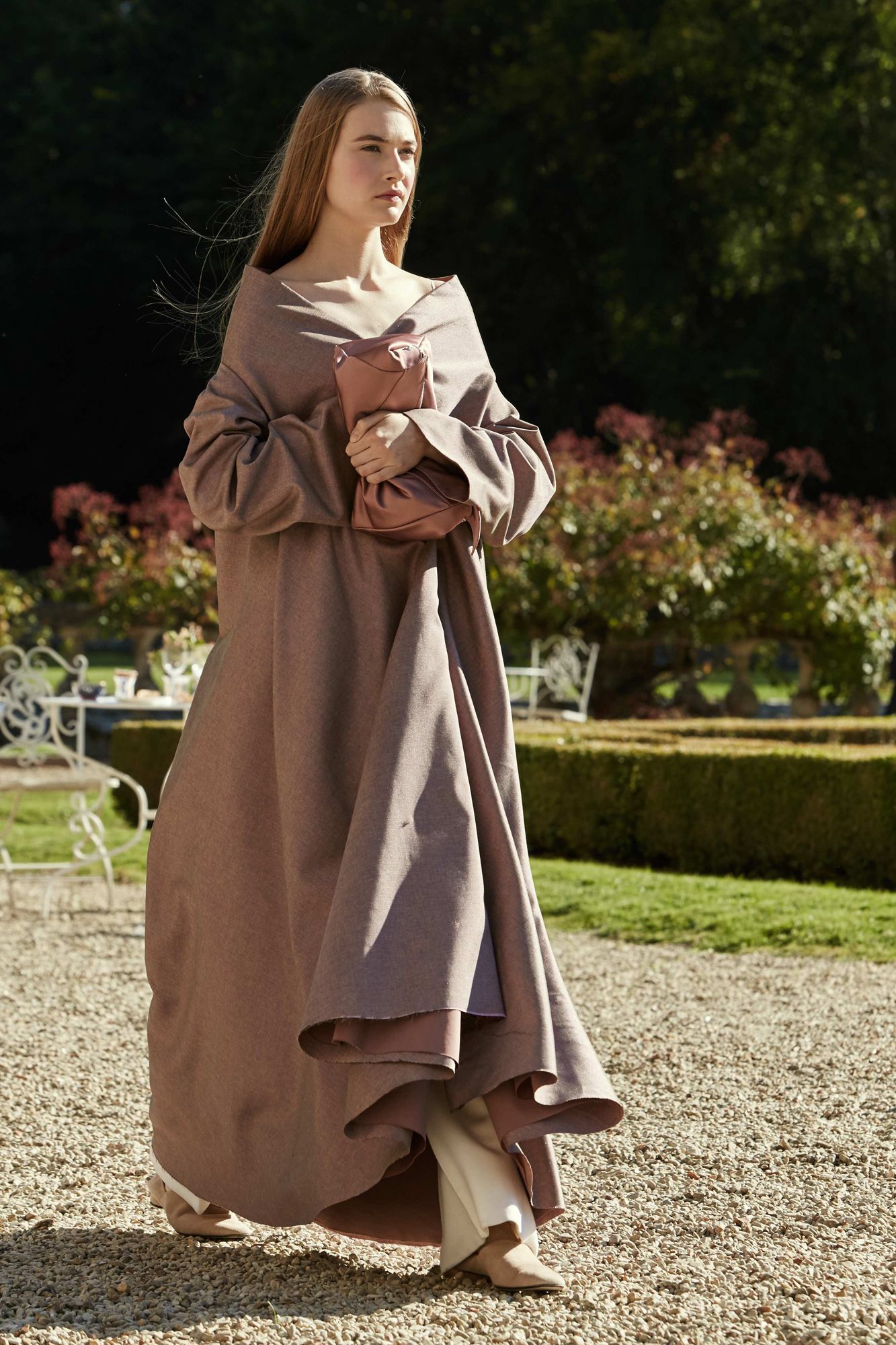 This image may contain robe and sleeves of clothing fashion characters