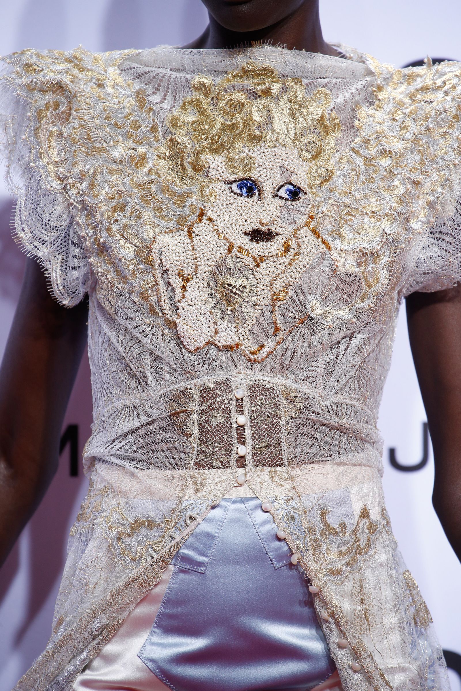 Images may contain clothing lace tops and sleeves
