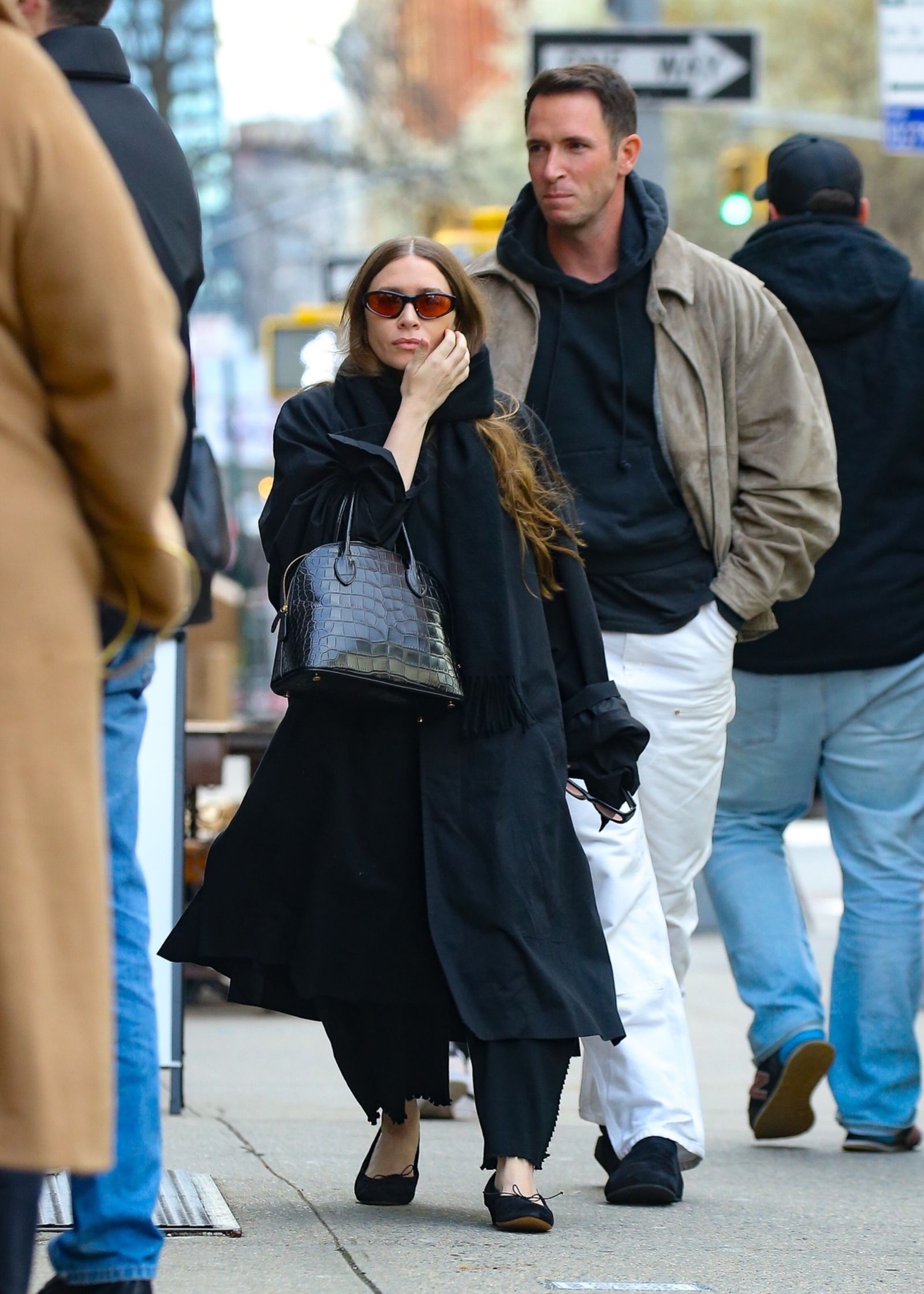 New York-exclusive Ashley Olsen brought the Big Apple to her runway while walking in a long coat.