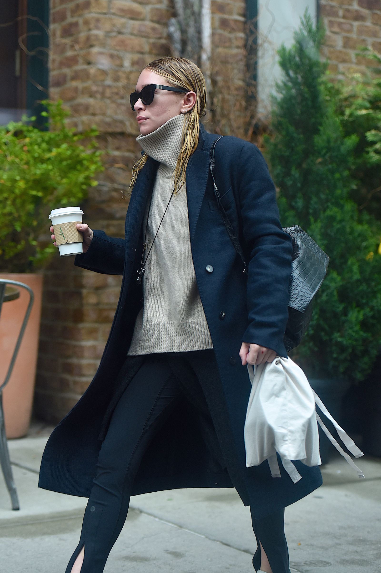 Images may contain Marykate Olsen Clothing Jacket Plant Accessories Glasses Handbags and Coats