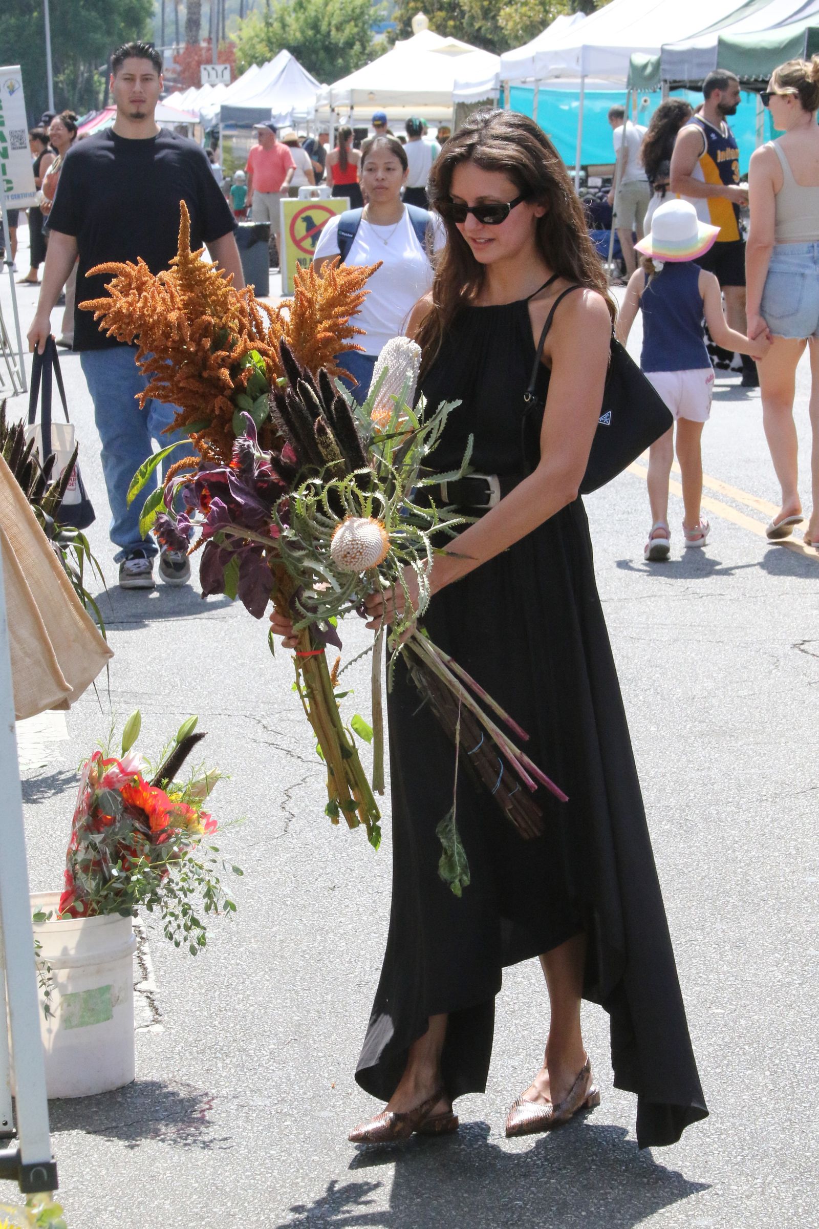 Images may contain Nina Dobrev Amerie Floral Arrangement Plants Bouquet Pot Plants and Hats