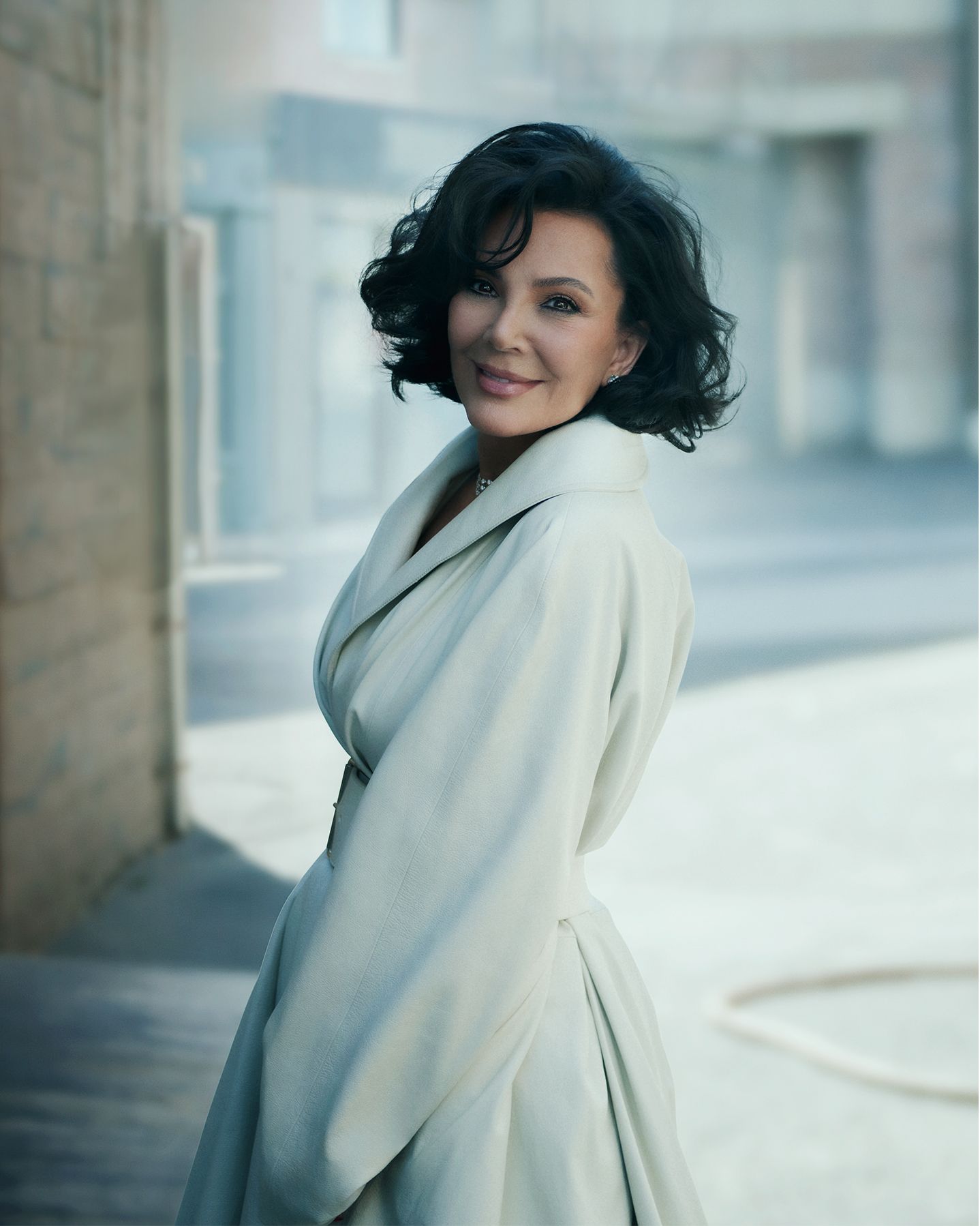 Images may contain Kris Jenner black haired human face happy head smile adult photography and portrait