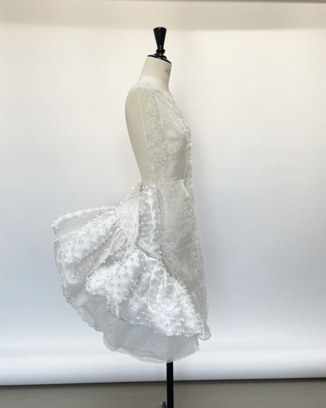 Images may contain clothing, dresses, adult wedding tops and formal wear