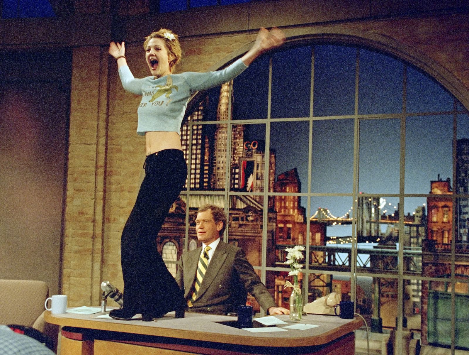 Images may contain Drew Barrymore David Letterman Cup Facial Man Photography Portraits and Accessories