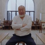 Ai Wewei sat on a stool in his studio.