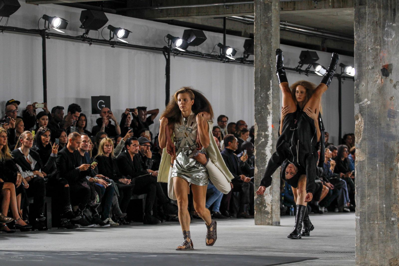 This image may contain clothing, footwear, clothing, shoes, dance posture, leisure activities and crowd