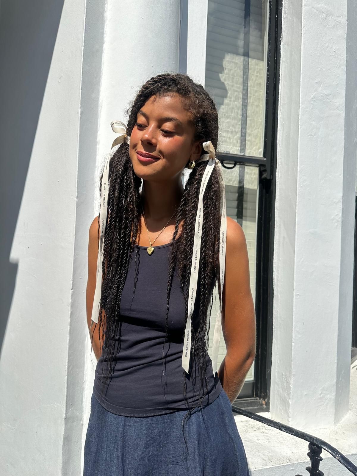 Images may contain hair staff teen accessories jewelry necklace cornflakes and braids
