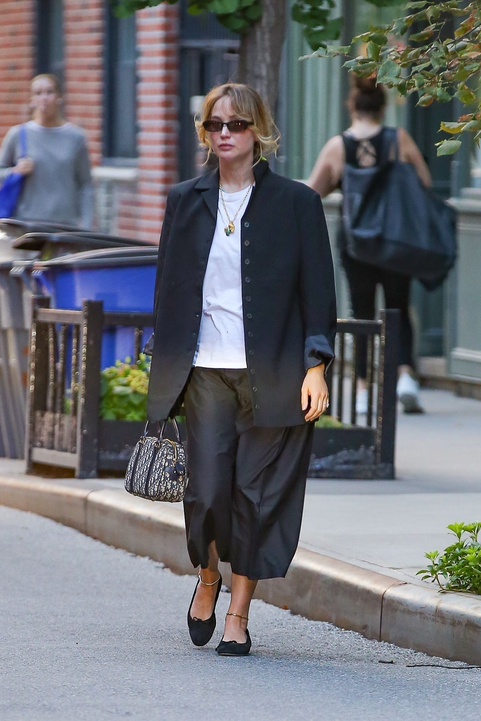 Exclusive New York New York actress and busy mom Jennifer Lawrence is amazing in black and white ensemble.