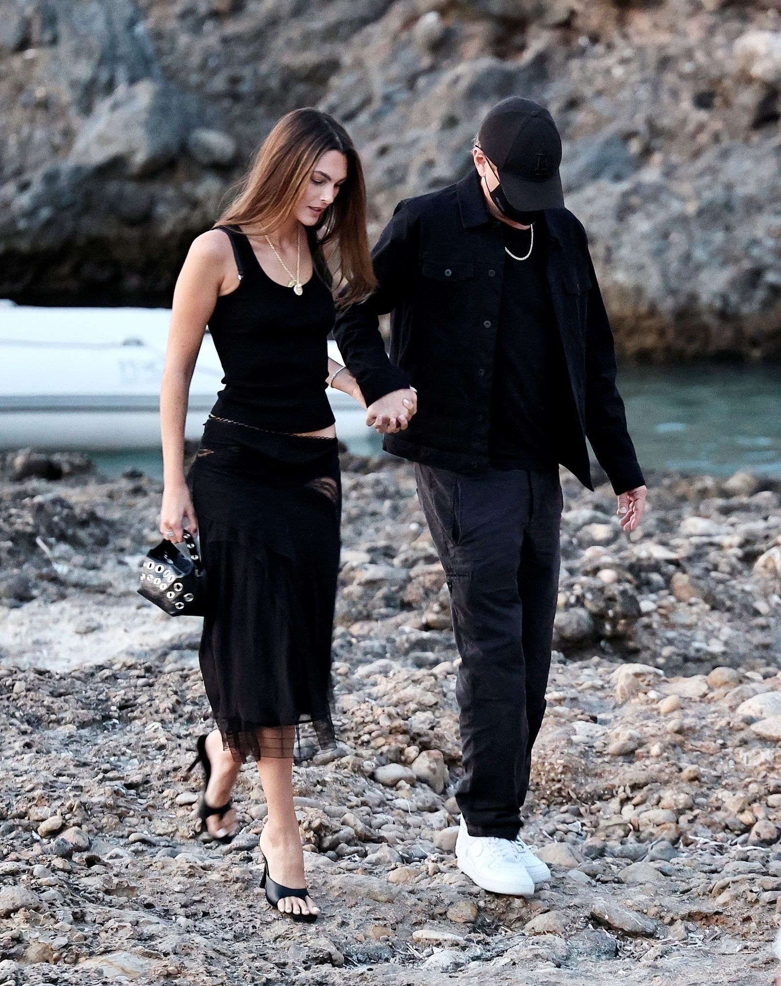 Images may contain handshakes of handmade clothing footwear high heels hat adults and accessories