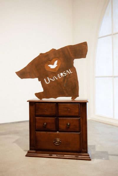 A sculpture consisting of T-shirts with the words 