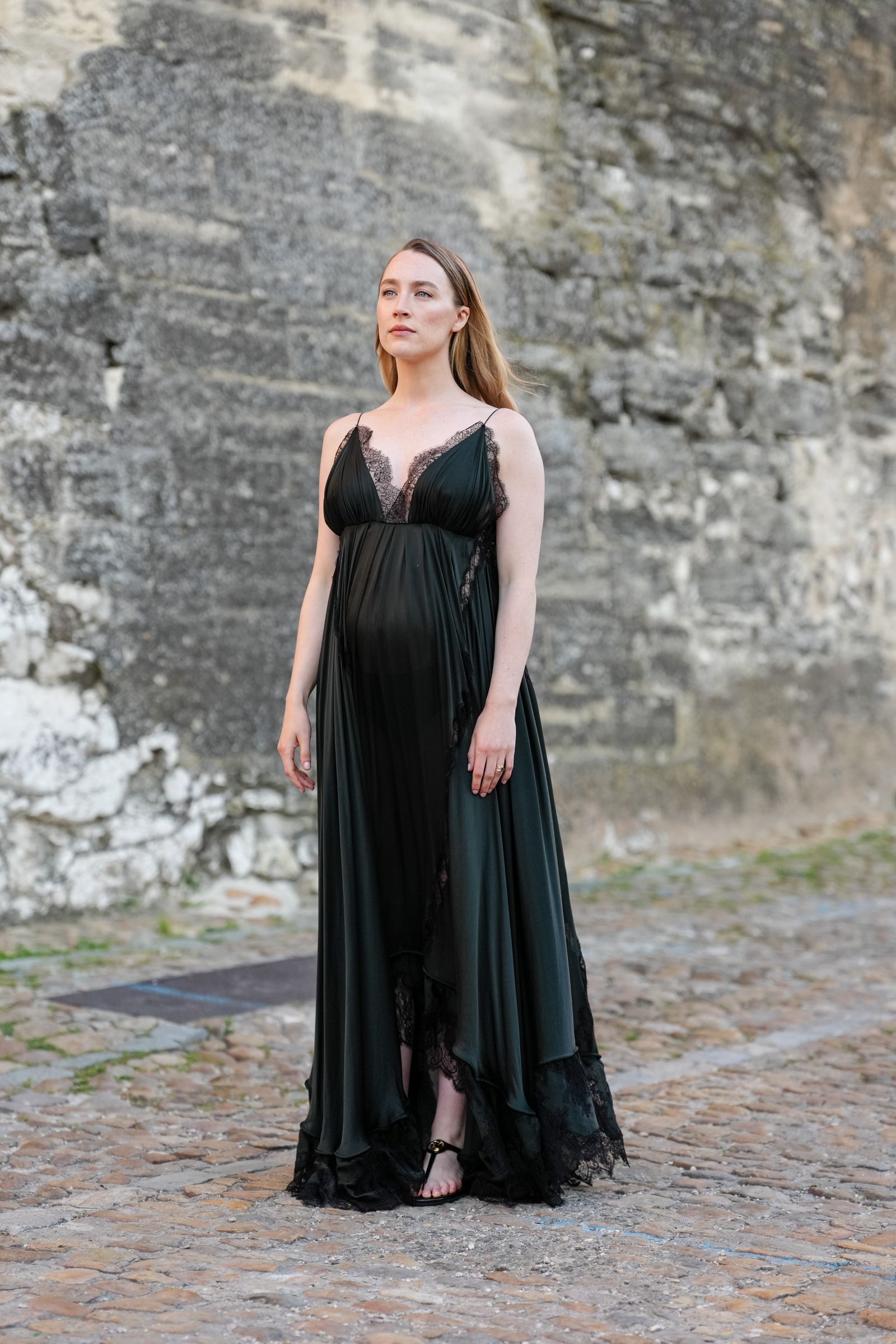 Images may contain Saoirse Ronan clothing dress evening dress formally worn adult standing fashion and gown