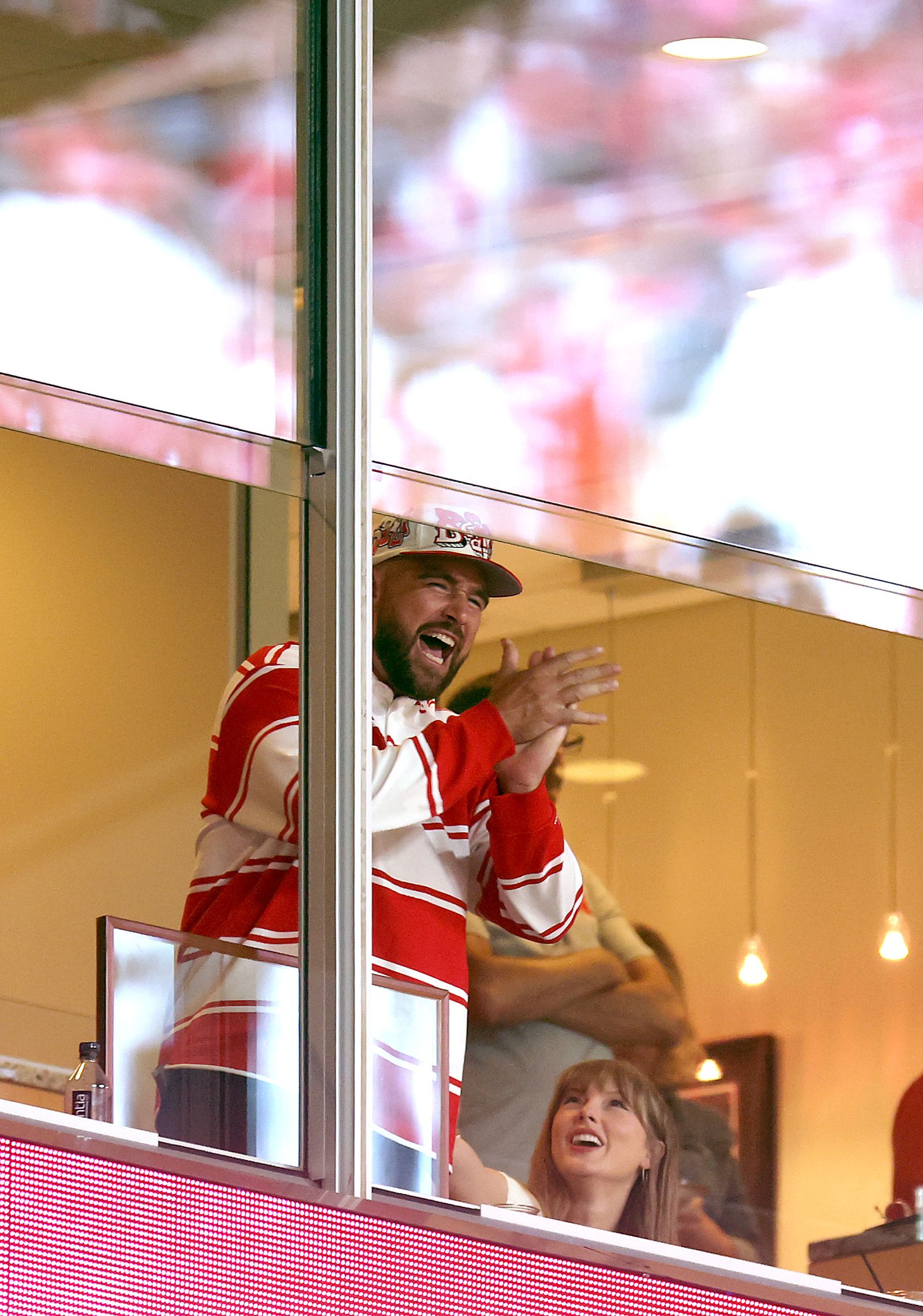 Travis Kelce 87, Chief of Kansas City, reacts to the smile of his fiancee Taylor Swift