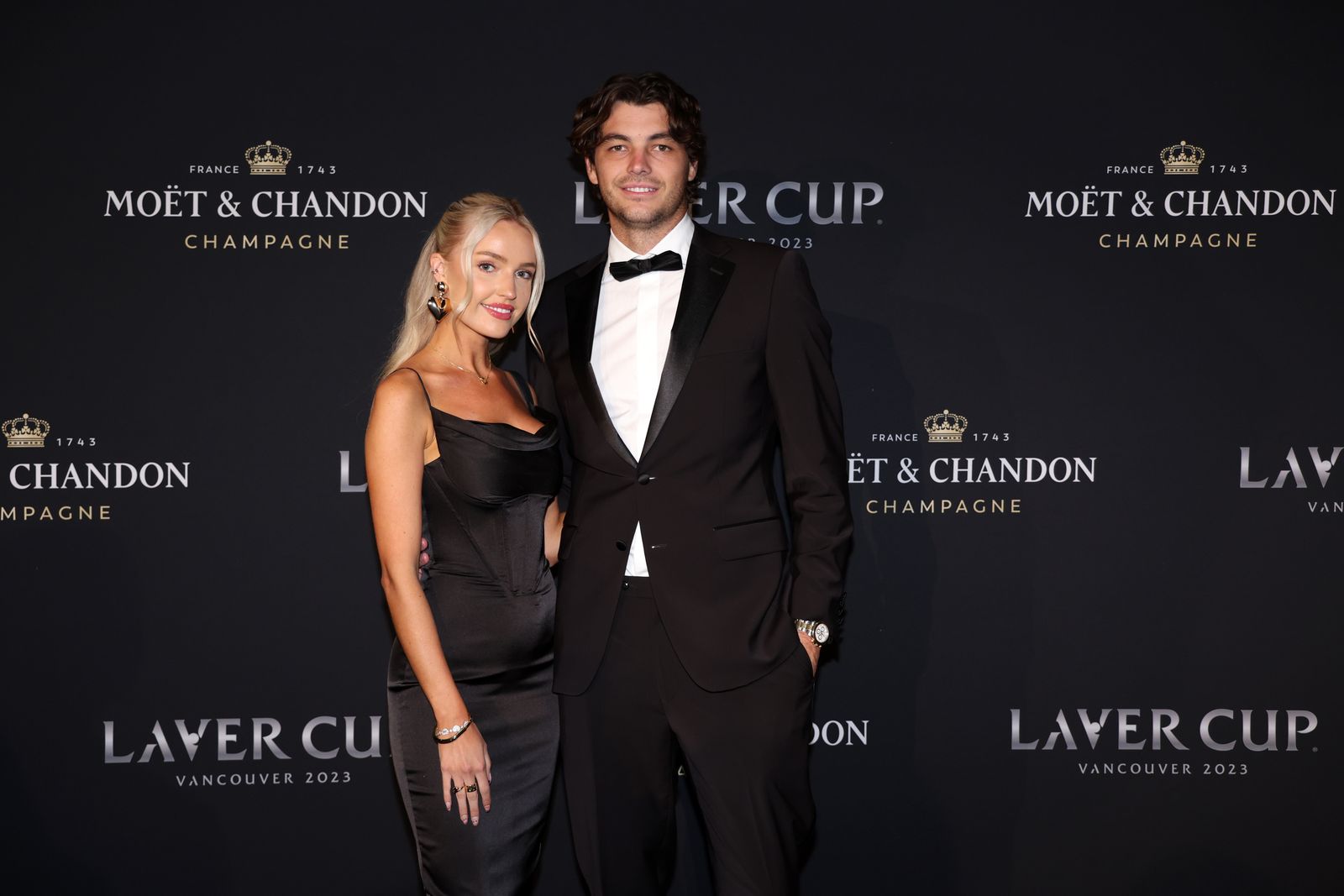 Images may contain Taylor Harry Fritz outfit formally wearing suits, fashionable adult accessories tie and tuxedo