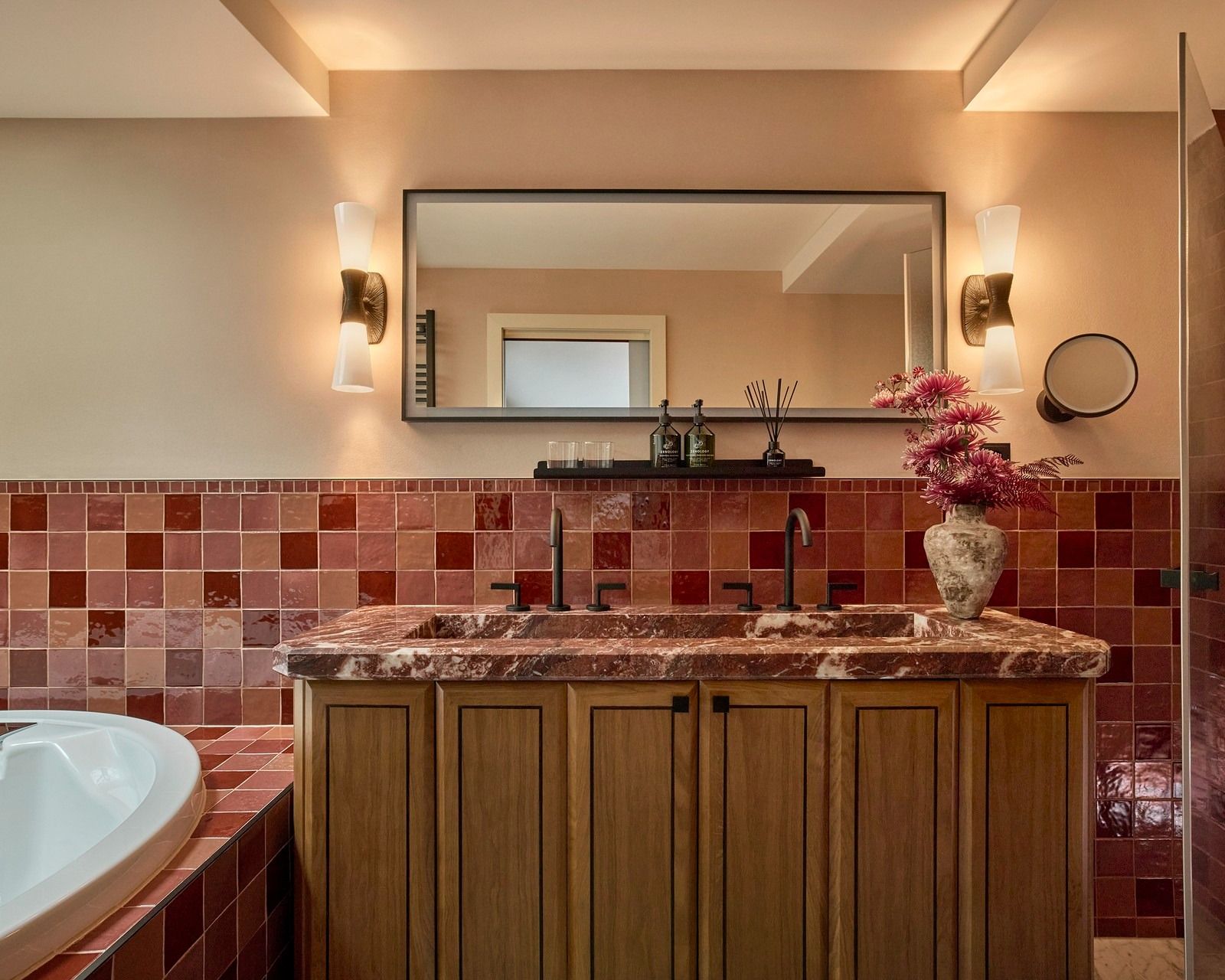Images may contain interior design lamp sink faucet bathtub people bathtub plants and hardwood