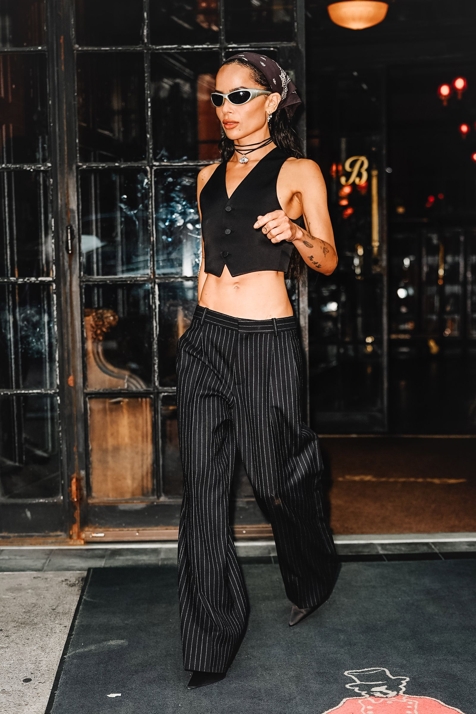 Images may contain Zoëkravitz clothing pants accessories glasses lamp jewelry necklace adult and footwear