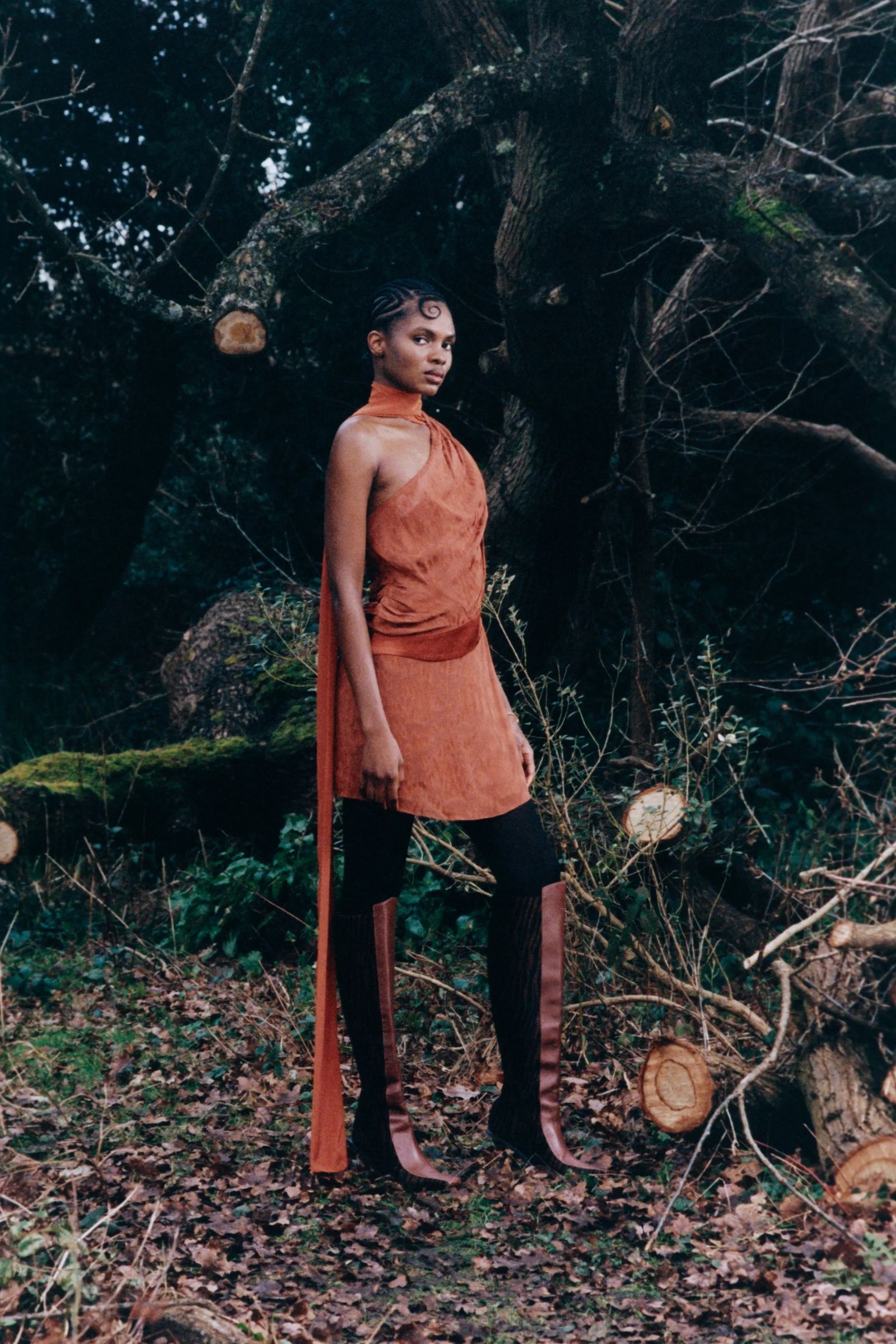Image may contain clothing sleeves standing shoes and trousers