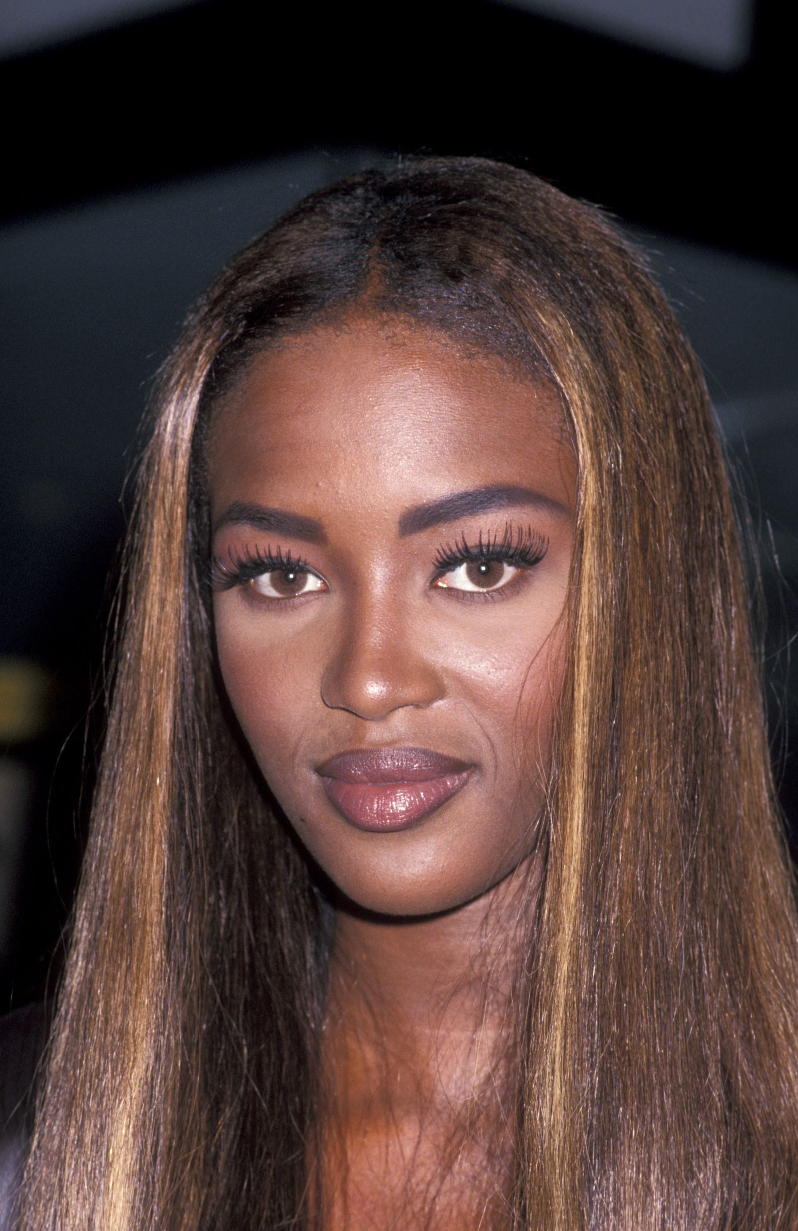 Images may contain Naomi Campbell face head adult skin photography and portrait