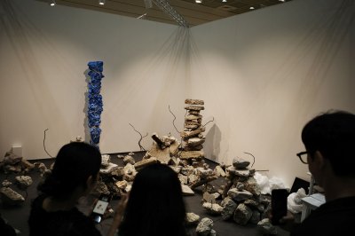 A site-specific installation consists of artists removing the rubble from the studio.