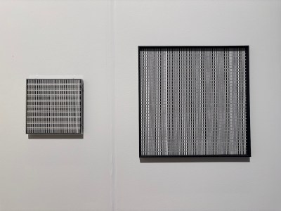 Two paintings of grid-like structures.