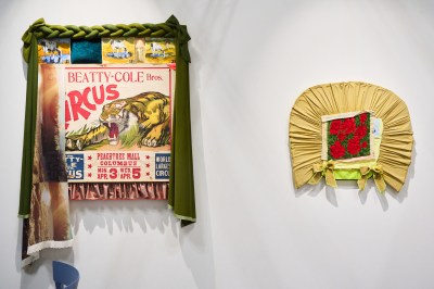 Three wall-hung sculptures consisting of various found fabrics.