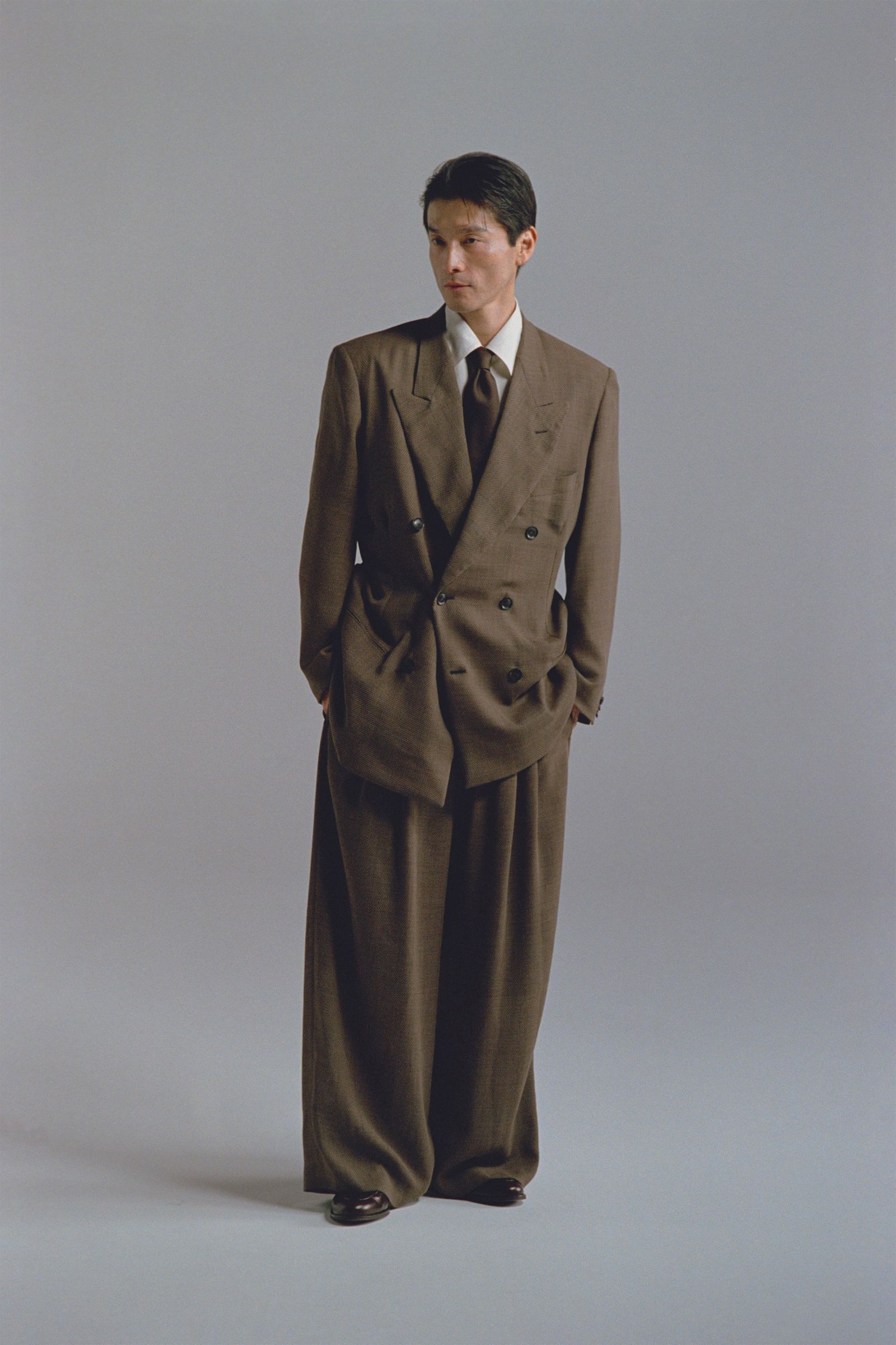 Images may contain clothing formal clothing jacket accessories tie adult tuxedo jacket and coat