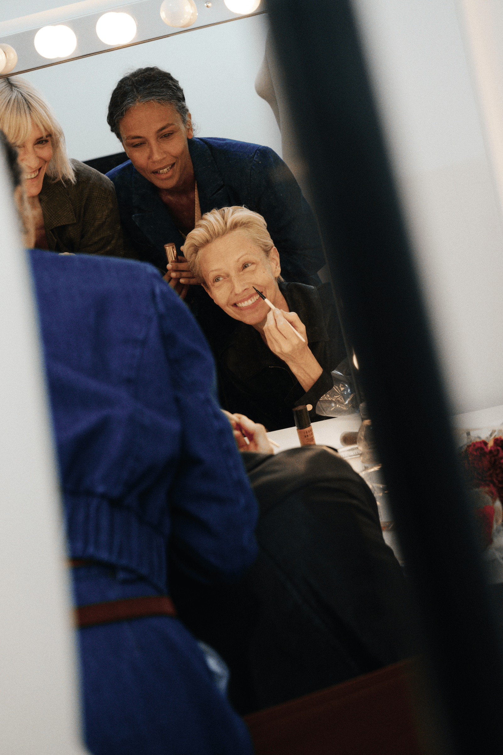 Modeling her own hair and makeup in Rachel Comey