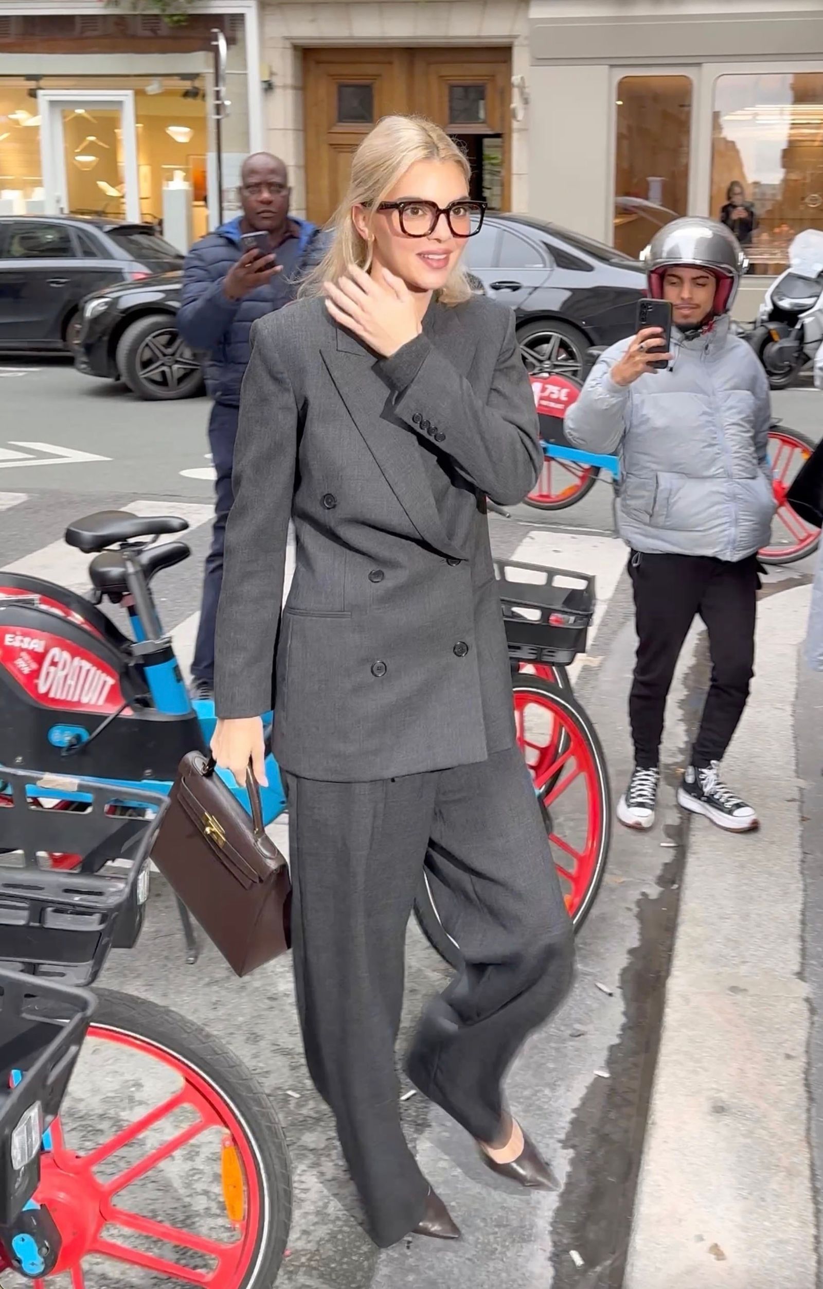 Images may contain Kendall Jenner outfit formally wearing blazer jacket helmet adults and footwear