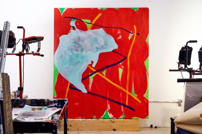 View of abstract painting is performed on the wooden platform while processing in the artist's studio. 