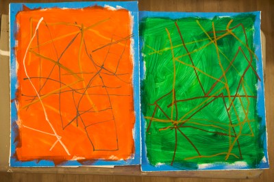 Two abstract works on paper. One is mainly orange; the other is mainly green. 