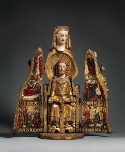 A sculpture of the Virgin Mary with its chest opened to reveal a seated Jesus Christ and paintings of people mourning him following his crucifixion.