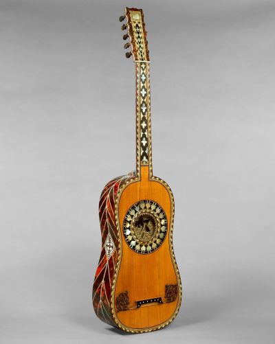 An ornate guitar with a star-shaped sound hole.
