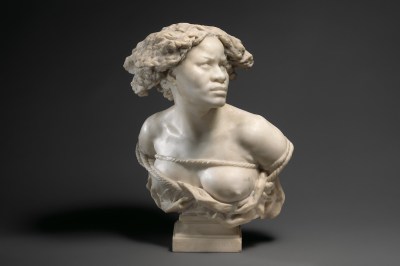 A bust showing a Black woman whose breasts spill out beneath a tightly tied rope.
