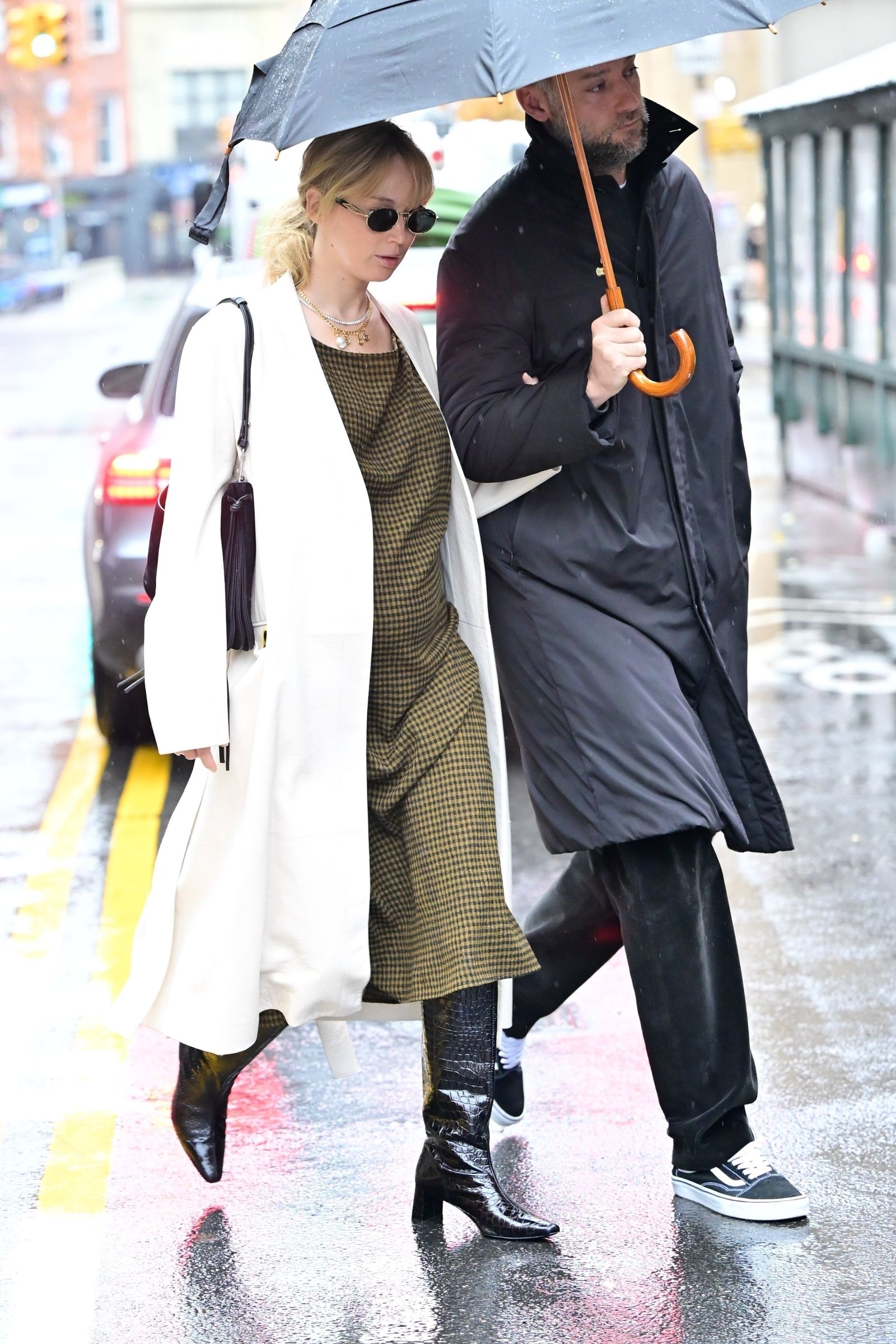 New York's exclusive glowing Jennifer Lawrence showed off her chic maternity style while out with her husband this morning...