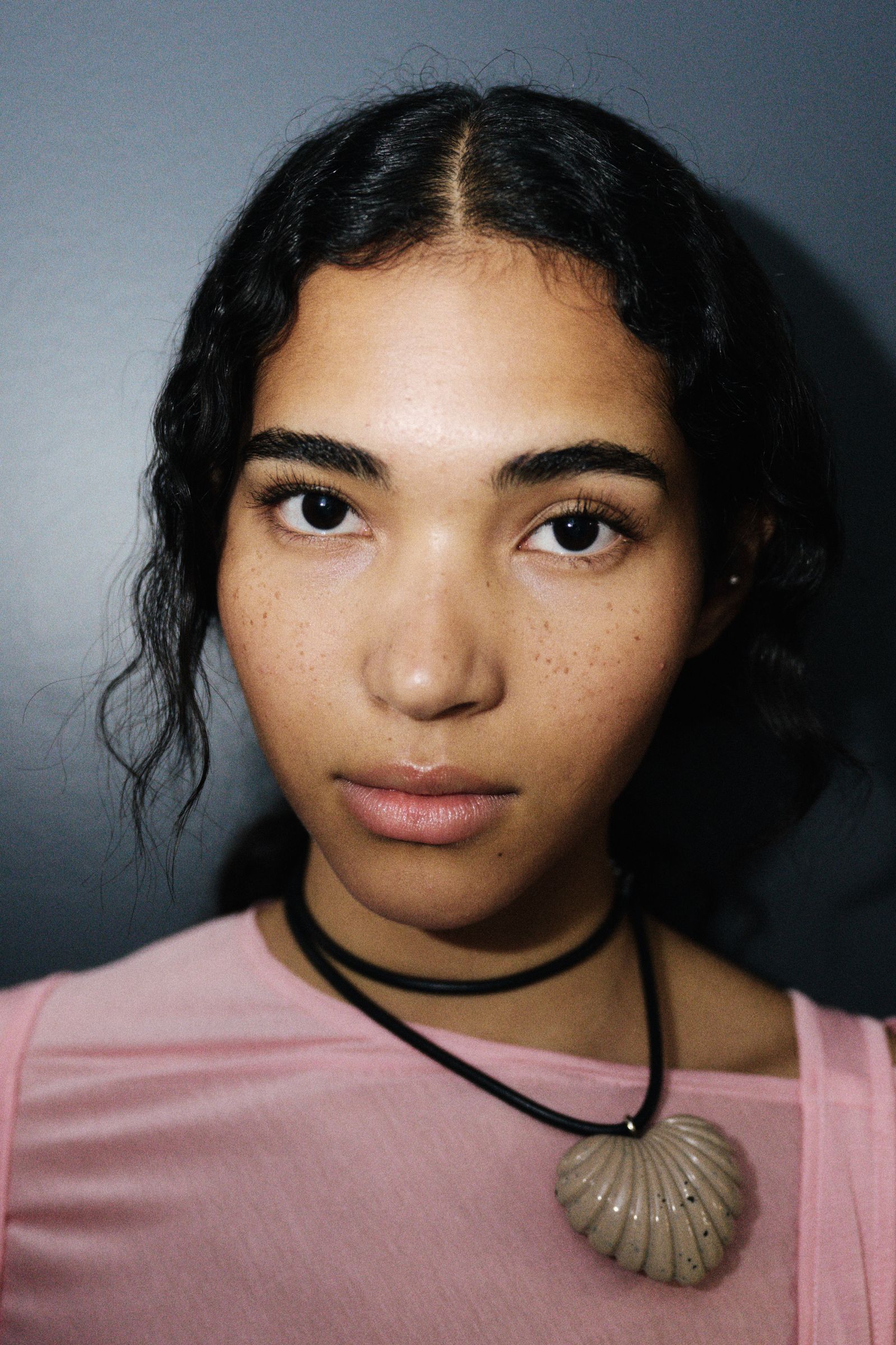 Modeling her own hair and makeup in Rachel Comey