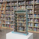 A tall bookshelf with a sculpture of a window with a ladder in front of it.