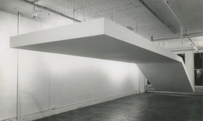 A large white sculpture hangs from the ceiling.