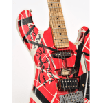 Stratocaster-style guitar with red body, seemingly random red and white strips with different thicknesses.