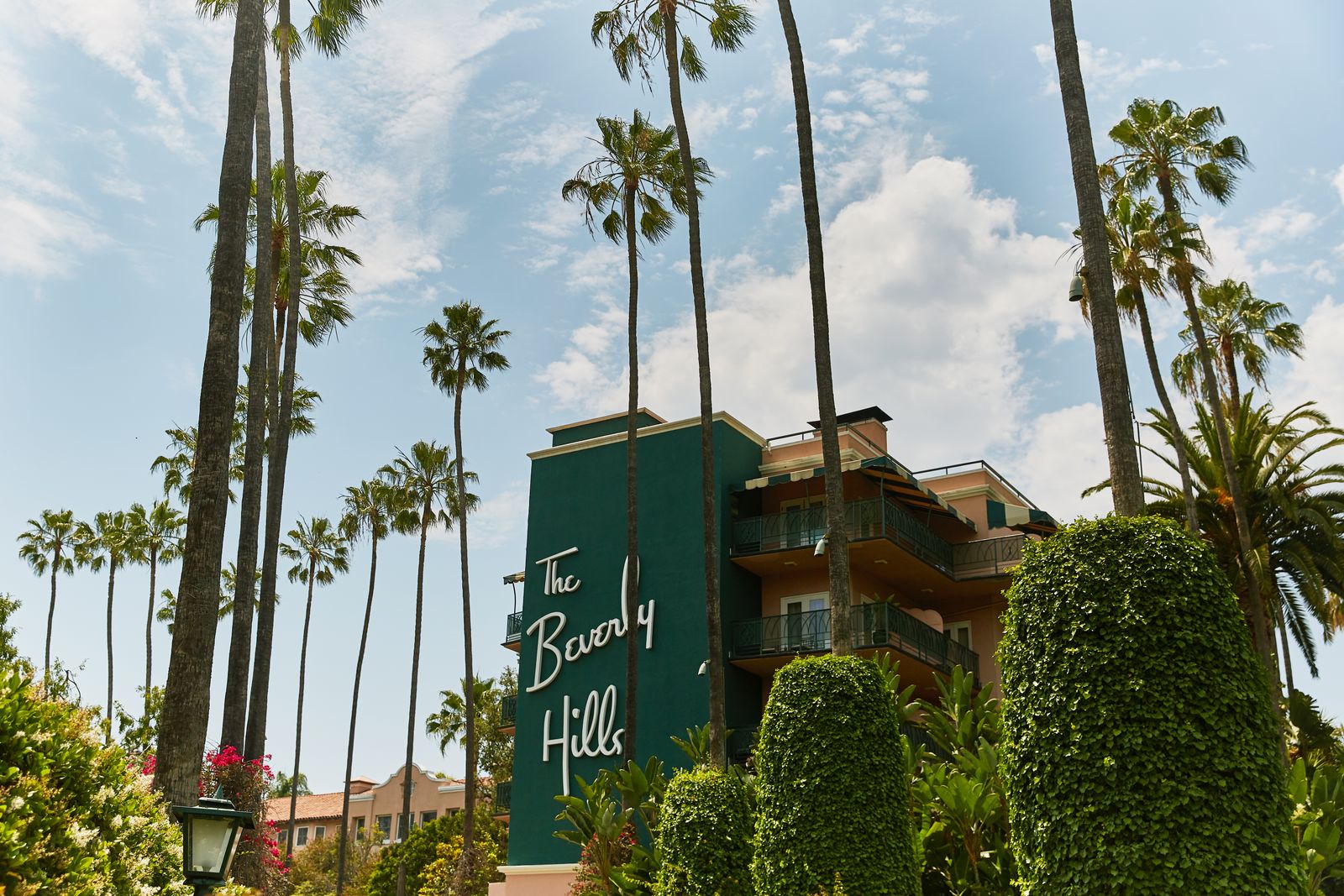 Images may contain architecture hotels plant trees palm trees vegetation summer apartments and housing