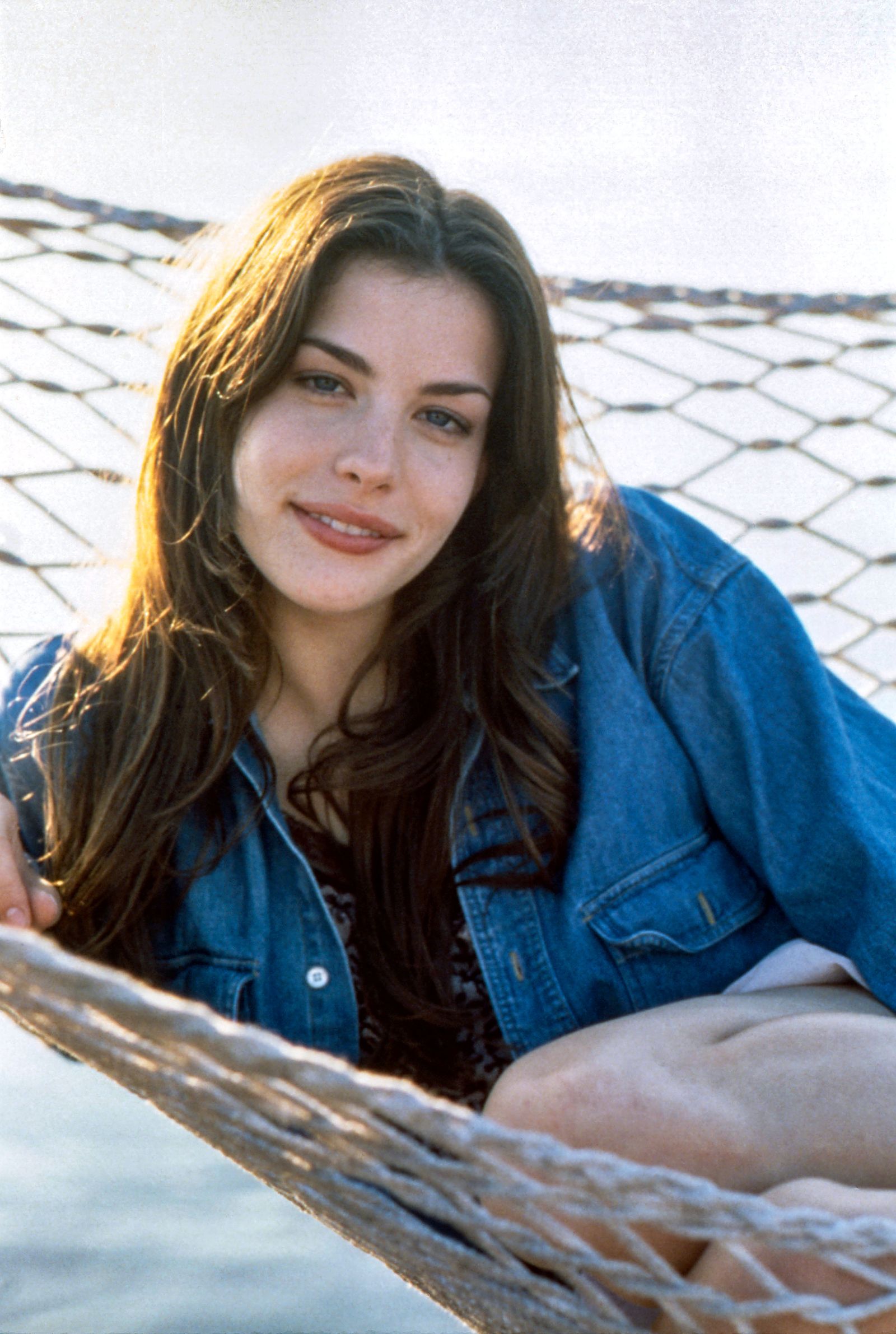 Images may contain furniture for people hammock clothing and Liv Tyler