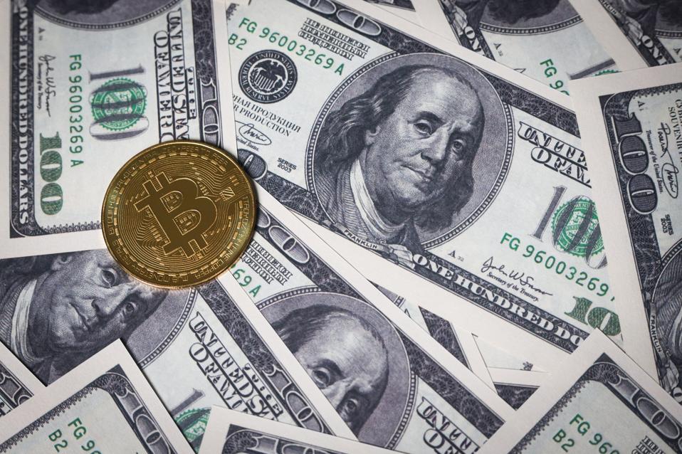 In this photo illustration, the new Bitcoin coin is...