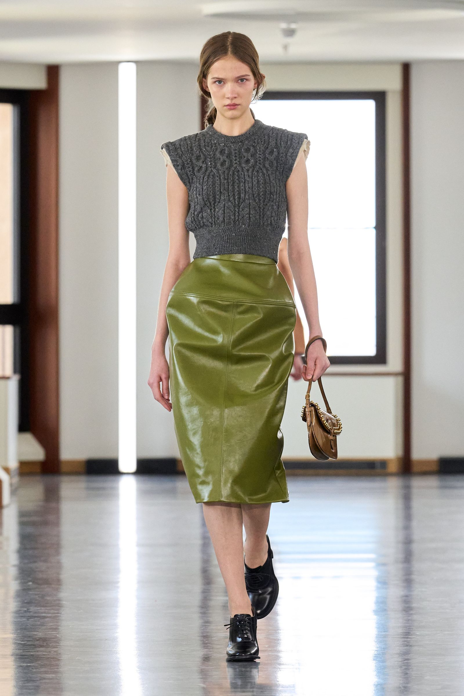 Images may contain Claudia Lee Clotsing Skirt Skirt Accessories Bag Handbag Shoes Shoes and Personnel